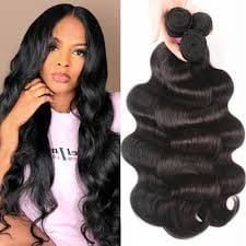 Natural-black body wave hair bundles beside a model wearing a flowing wave style